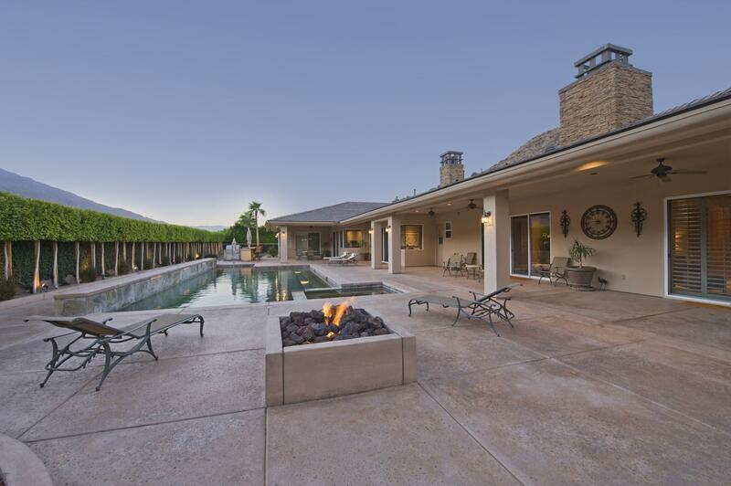 Pool deck with adjacent fire pit